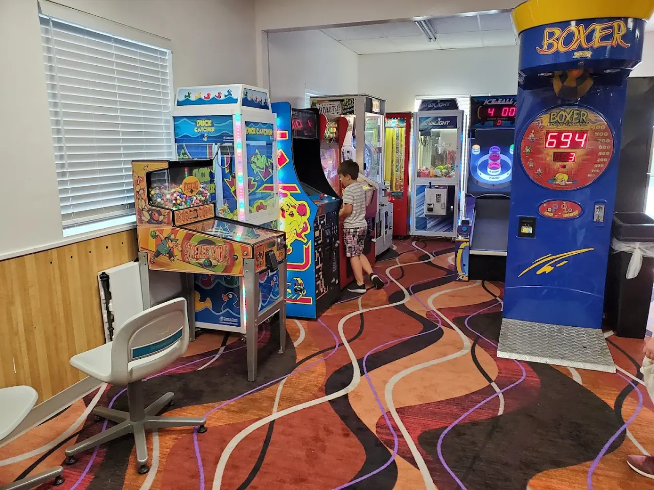 The arcade at Lokay Lanes with claw machines and pinball