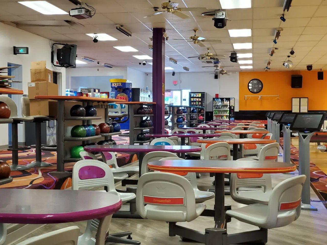 Seating, tables and ball racks on the concourse at Lokay Lanes